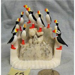 Puffin rookery with 10 puffins- carved ivory- by Al Mayac- 2-3/4" long and 3-1/2" tall