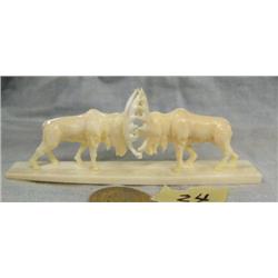Carved ivory of 2 bull moose by Don Savage- base is approx. 4-1/4" long, figure approx. 1-1/2" high