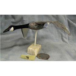 Carved ivory flying Canada Goose by C. Kokuluk- approx. 4-1/2" bill to tail; 5" wing tip to wing tip