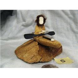 Whale bone kayaker with ivory face by John Wiltsky- kayak approx. 4-1/2" long; figure approx. 3" tal