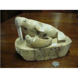 9" carved bone walrus by Aningayou- mother and child, she has ivory tusks- 485f