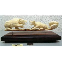 10" ivory carving of bear and wolf fighting by Noel Smith