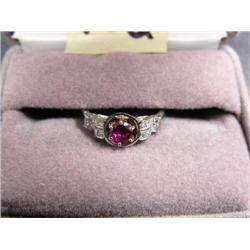 Lady's White gold, diamond and ruby ring. Lab created ruby 5mm round, 16 .01 ct.. Diamonds set on si