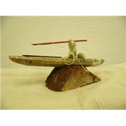 Soapstone kayaker mounted on whale bone base by Chuck- 3-1/2" tall and 7-3/4" long