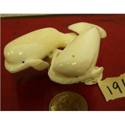 Pair of carevd ivory beluga mounted on ivory by Seeganna
