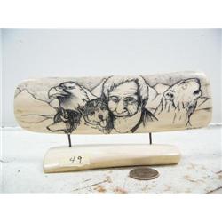 7" scrimshawed mammoth ivory of man, 2 dogs, an eagle and bear head by Home Cole (114)