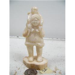4-3/4" fossilized walrus ivory man with baby on his back by Vaughn Walunga (114)