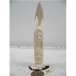 5" mammoth ivory carving mounted on fossilized walrus ivory of 2 men and whale by Iglaak of Koyuk (1