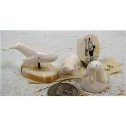 Group of 4 carvings: walrus, bear, whale, scrimshawed hunter (114)