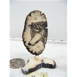 CHOICE on 4 three inch scrimshawed fossilized ivory by Homer Cole: wolf's face (114)