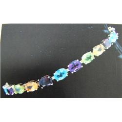 Multigemstone Bracelet, 14 K yellow gold- Peridot, amethyst, garnet, blue topaz, and citrine are ova