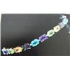 Image 1 : Multigemstone Bracelet, 14 K yellow gold- Peridot, amethyst, garnet, blue topaz, and citrine are ova
