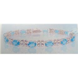 Blue Topaz and Diamond Bracelet, 14 K yellow gold- blue topaz are oval, faceted, approx. 10.00 carat