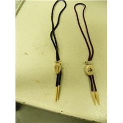 2 ivory bolo ties circa 1950: carved walrus head with ivory drops, scrimshawed Eskimo picture with i