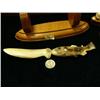 Image 4 : Carving by Steve Byazroy 4" fossilized ivory salmon handled letter opener 9.5" long on wood base (25