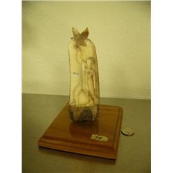 Fossilized ivory carving by Gary Buttoner of falconer with falcon 6.5" tall mounted on wood base #BT