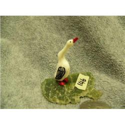 Carved ivory bird mounted on jade- 2-1/4" tall, 2-5/8" wide base