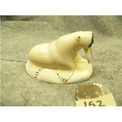 Carved white ivory walrus made by L. O.- 1-1/2" tall, 2-1/2" wide