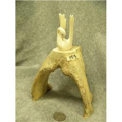Carved ivory swan mounted on a jawbone- 7-3/4" tall
