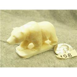 Carved white ivory bear by Don Savage- 1-1/2" tall, 2-3/4" wide