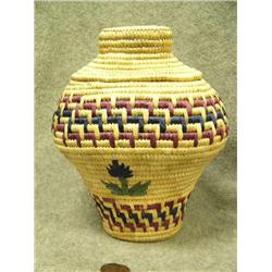 Elliptical shaped Yup'ik basket made by Ellen Dock of Kipnuk with dyed grass design- dyed grass flow