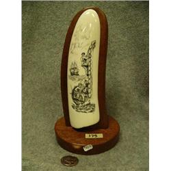 Scrimshawed ivory mounted on wood- excellent and detailed scrimshaw of ship in background and 3 men 