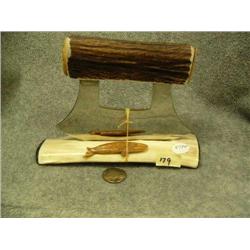 Antler handled Ulu mounted on bone- mount has baleen tips and also a carved wale; handle has a carve
