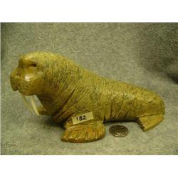 Soapstone walrus by Eric Tepon III with ivory tusks- 4" tall, 8" long (2)