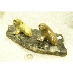 Pair of soapstone seals mounted on marble (2)