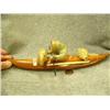 Image 3 : "Eskimo Hunter" by Jesse Higgins- kayak made from wood; hunter, seal, seal poke made from soapstone;