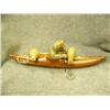 Image 6 : "Eskimo Hunter" by Jesse Higgins- kayak made from wood; hunter, seal, seal poke made from soapstone;