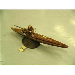 Soapstone kayaker/hunter mounted on bone- 12-1/2" long (2)
