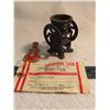 Image 1 : cast mill figurine, tin guitar, Sask dairy pool tag
