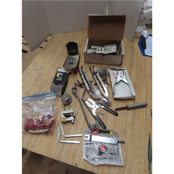 assorted small engine tools - ring expanders, ridge reamer, tachometer, etc.