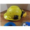 Image 3 : hard hat with ear muffs and weedwhacker wire
