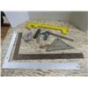 Image 1 : carpenter's squares, framing guide, plumbob, etc.