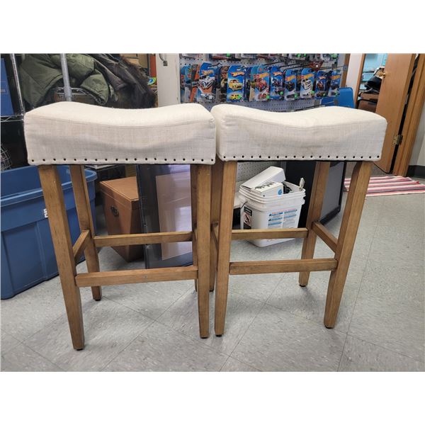 Pair of Linen Cushioned Medium height Saddle Stools