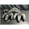 Image 2 : Lot of 1 Nintendo 64 Console with Pokemon Puzzle League and 2 Controllers