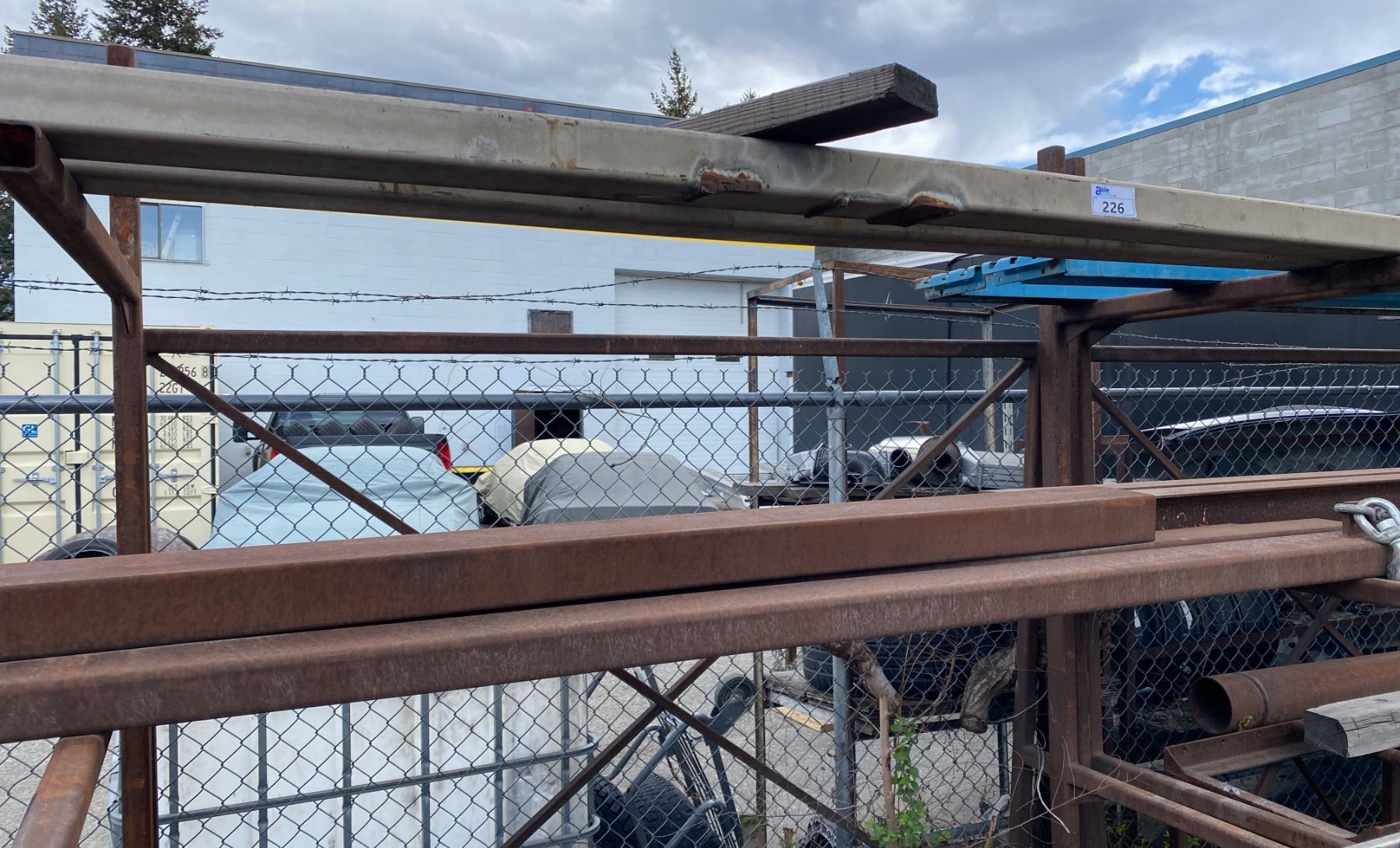 CONTENTS OF 4 RACKS. SQUARE TUBING, LARGE PIPE, CHANNEL IRON