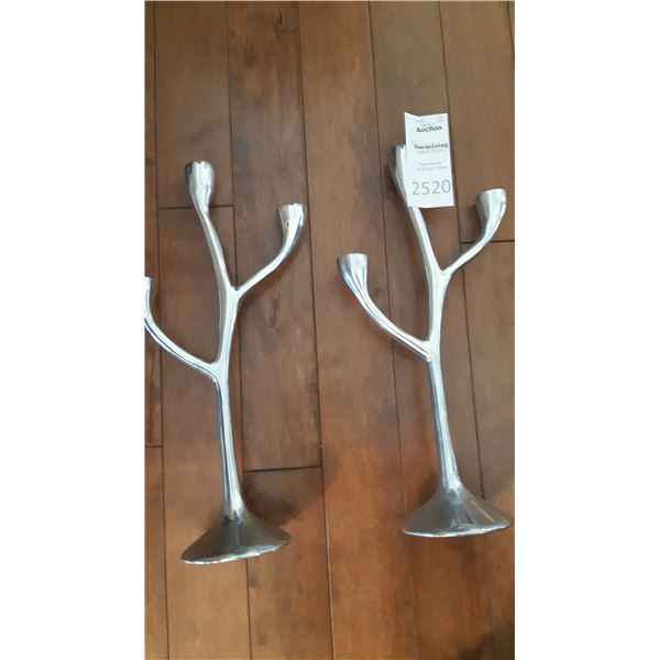 Silver colored candle holders A