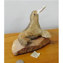 Whale bone seal with salmon in mouth mounted on soapstone, 528f (2)