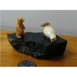 Fossilized ivory bear and seal on soapstone base (2)