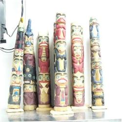 Lot of 13 totem poles- not Alaskan, imported- approx. 24-1/2" to 28" tall (114)