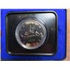 1976 Specimen Nickel Dollar. Voyageur. Housed in its original Royal Canadian Mint blue clamshell cas