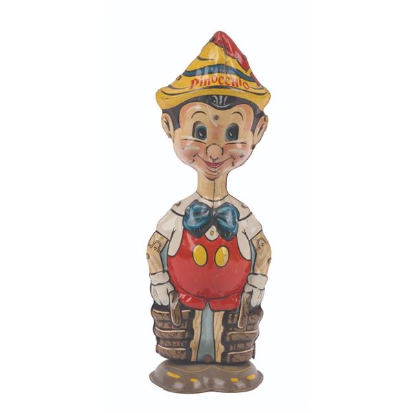 A Pinocchio Wind-Up Tin Toy.