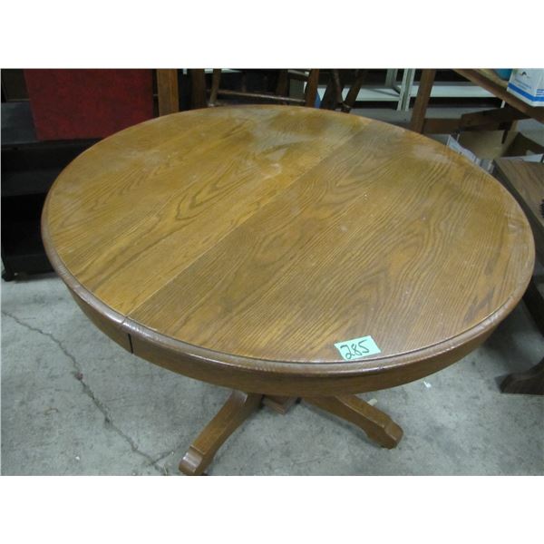 Vintage Round Table with three leaves has been refinished