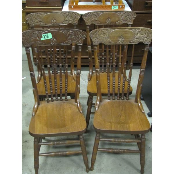 Set of four vintage press back chairs