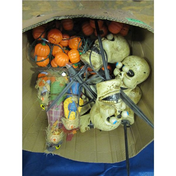 Box with assorted Halloween decorations