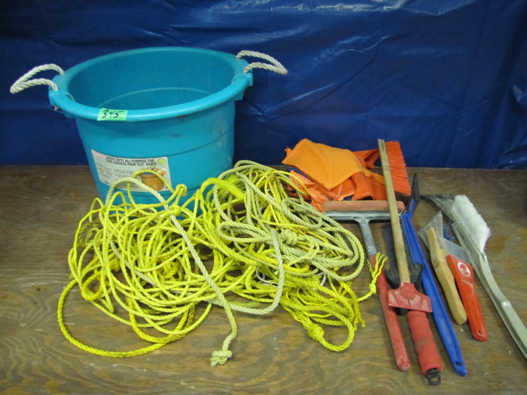 Container with rope , squeegee, snow brushes , etcetera