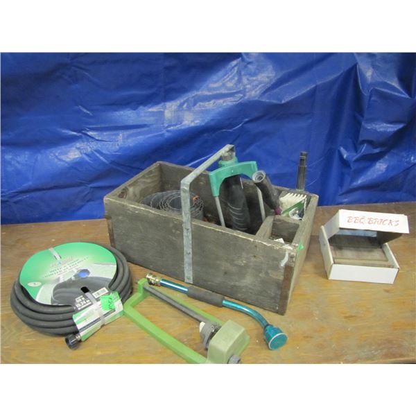 wood box With soaker hose sprinklers waters